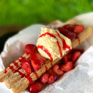 Churros with vanilla ice cream and strawberries