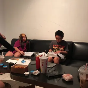 a group of people sitting around a table