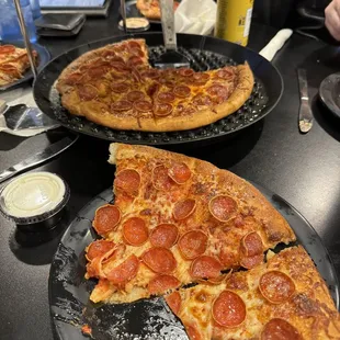 two slices of pepperoni pizza