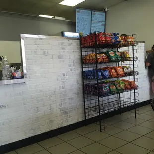 a woman standing in front of the counter