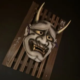 a mask on a wooden pallet