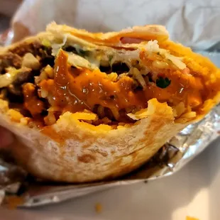 Carne Asada Burrito but threw some of the red sauce on it for a little kick
