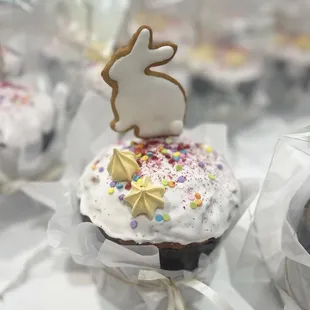 a cupcake with frosting and sprinkles