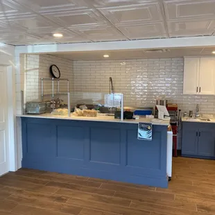 a kitchen with a blue island
