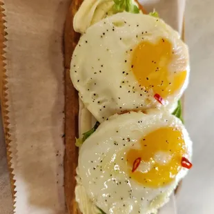 two fried eggs on a toasted bread