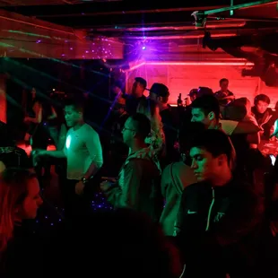 a group of people dancing at a party