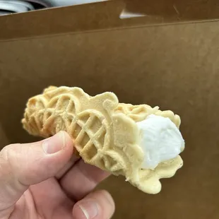 Rolled pizzelle with donut cream inside