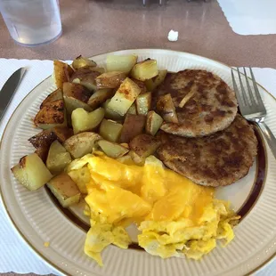Scrambled egg with cheese. Home fries. Sausage.