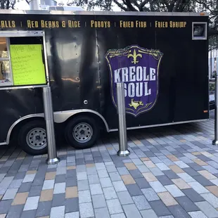 a food truck parked on a sidewalk