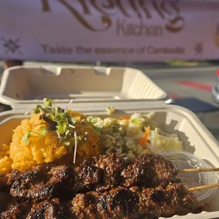 Beef skewers and coconut rice.