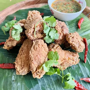 Cambodian Fried Chicken Wings. Gluten Free. Served with our garlic lime sauce.