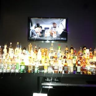 a bar full of liquor bottles