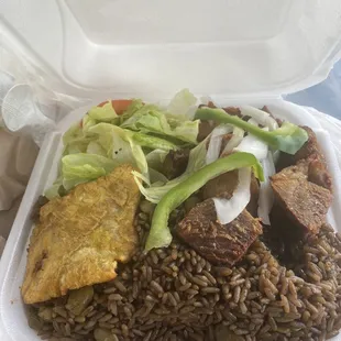 Griot (fried pork) with diri djondjon (black rice)