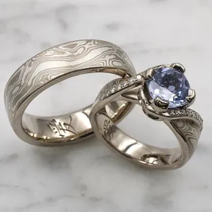 Custom wedding ring set with sapphire engagement ring, Chinese character interior engraving, and Mokume Gane pattern