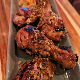 Coco Adobo Drumsticks. $16. Papaya relish.