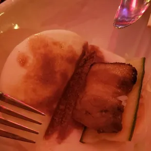 inside of the pork belly bun; a fork for size comparison