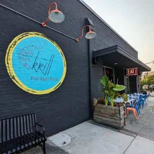 Outside. Storefront. Sidewalk patio. They have a separate and enclosed patio too.