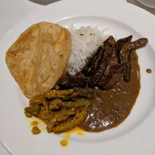 Eggplant kulambu, tindola, paratha, rice.