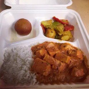 a meal in a styrofoam container