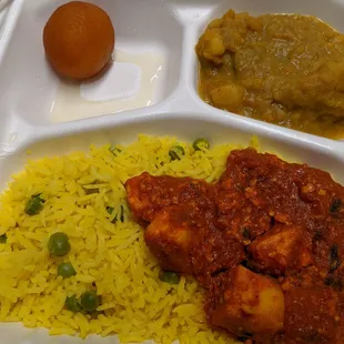 a tray with rice, curry, and an egg