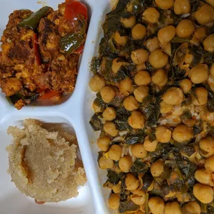 a plate of chickpeas, spinach, and mashed potatoes