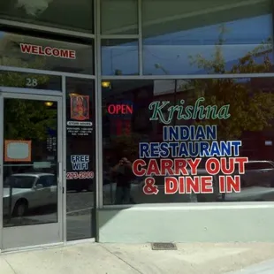 the entrance to a indian restaurant