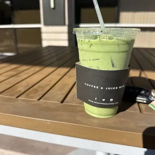 outdoor seating sipping on the blueberry matcha