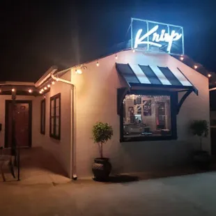 the front of krisp's restaurant at night