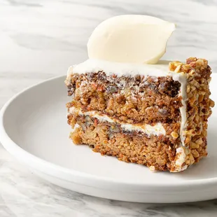 Carrot Cake-made with carrots, raisins, pineapple and pecans, layered and covered with cream cheese frosting