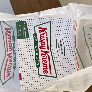 a bag of krispy kreme doughnuts