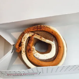 Pumpkin Spice Cheesecake Swirl Donut with a dusting of cinnamon sugar on top