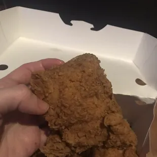 Close up on a thigh from the "chicken dark (8 pieces)" entree