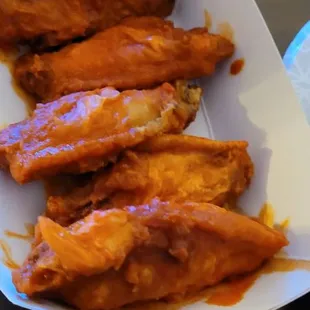 a plate of chicken wings
