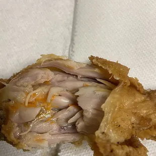 Undercooked chicken! And we don&apos;t know what that orange stuff was!  Red beans and rice and Mac n&apos; cheese can be passed on too