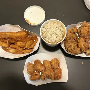 Fries, chicken nuggets, chicken breast, drumstick, and rice and beans