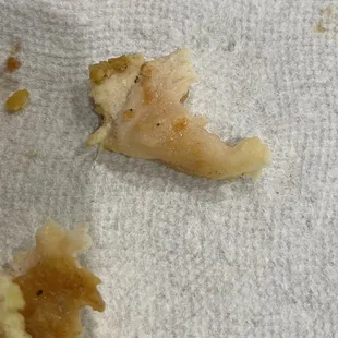 That is raw chicken meat in the sandwich