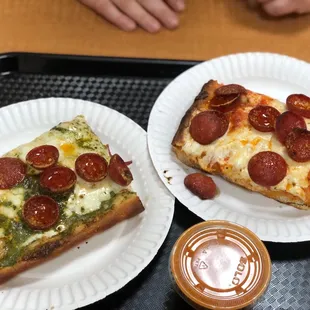 Pesto pepperoni slice, vodka pepperoni slice and a side pot of vodka sauce