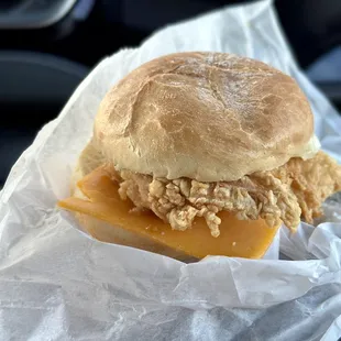 a sandwich wrapped in wax paper