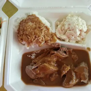 a close up of a meal in a styrofoam container