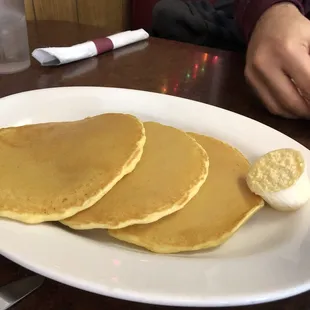 a plate of pancakes and eggs