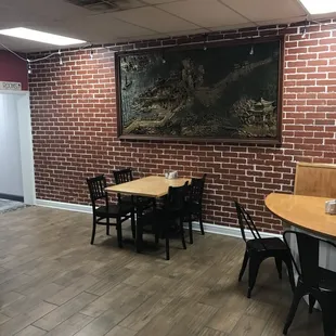 a dining area with tables and chairs