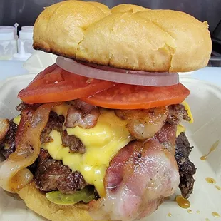 The Widow Maker!!!  Bring your appetite this bad boy is 9 0z. of angus beef, 4 slices of bacon, 3 slices of cheese and all the toppings!