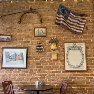 a brick wall with american flags