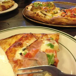 a slice of pizza on a plate
