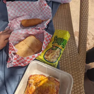 pizza is a soft slab of bread topped w sauce and cheese.