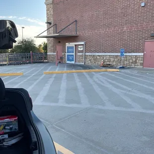 the back of a motorcycle parked in a parking lot