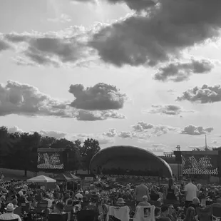 a black and white photo of a crowd of people