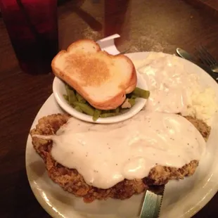 fried chicken with gravy and mashed potatoes