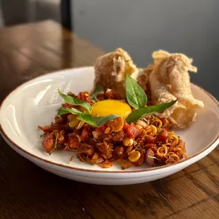 a plate of food on a wooden table