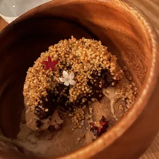 Chocolate- dessert with a chocolate lava like cake on top of coffee ice cream